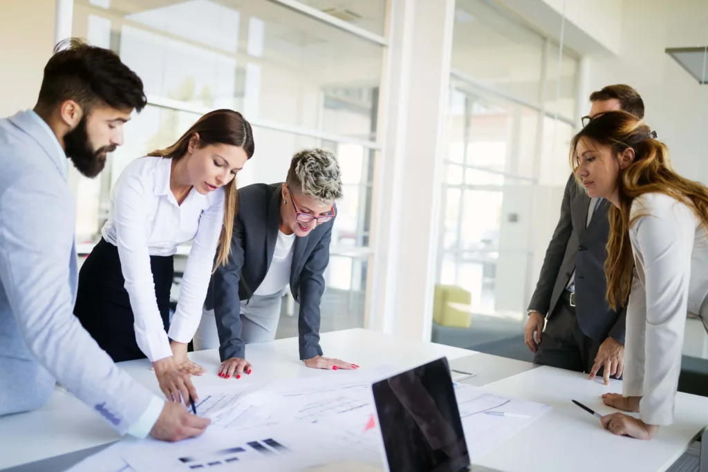 Business colleagues in conference meeting room during presentation