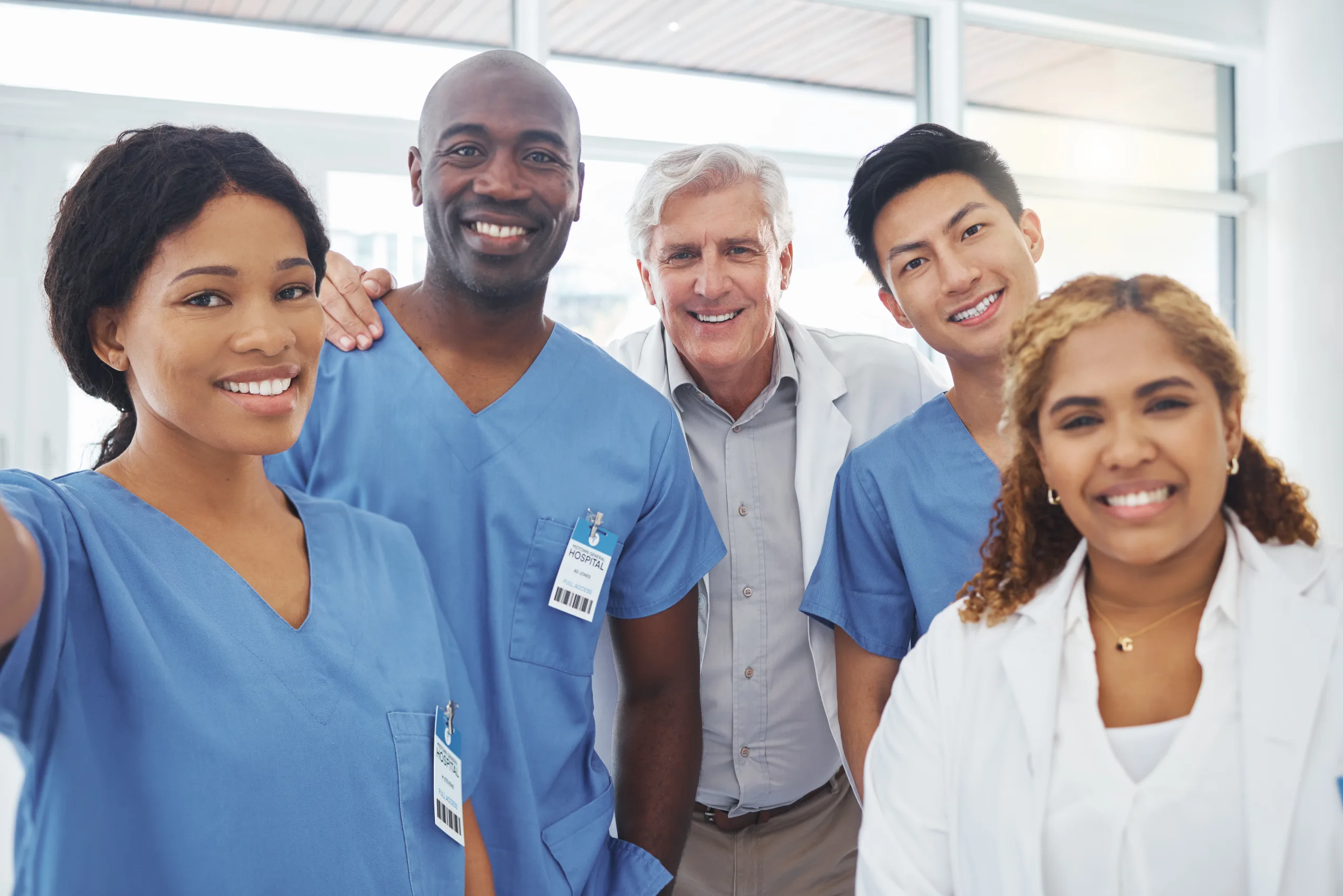 Portrait of a group of medical practitioners smiling together in a hospital