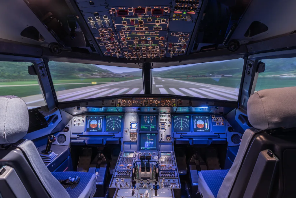A view of the cockpit of a large commercial airplane