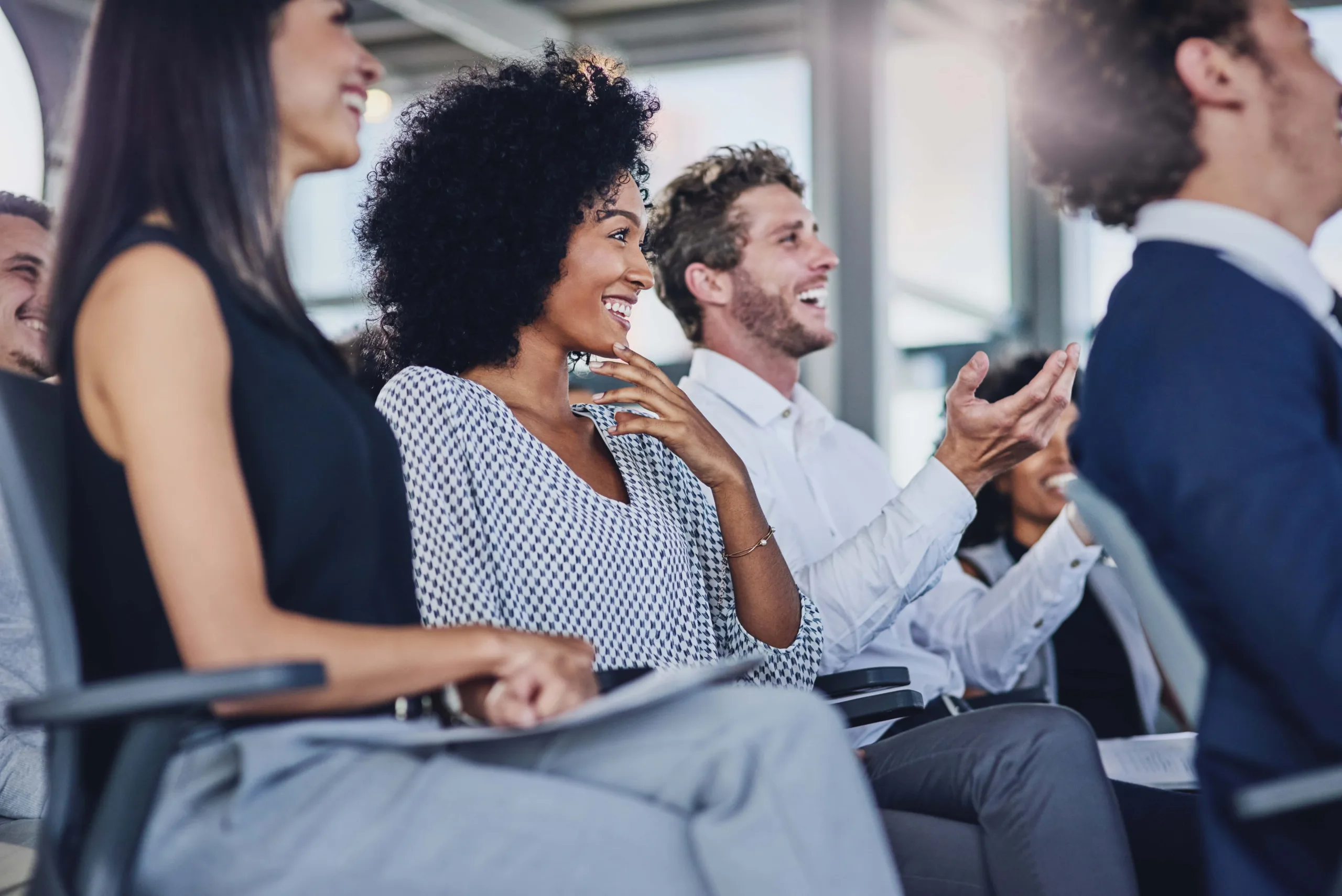 Group of businesspeople sitting in the conference room during a seminar.