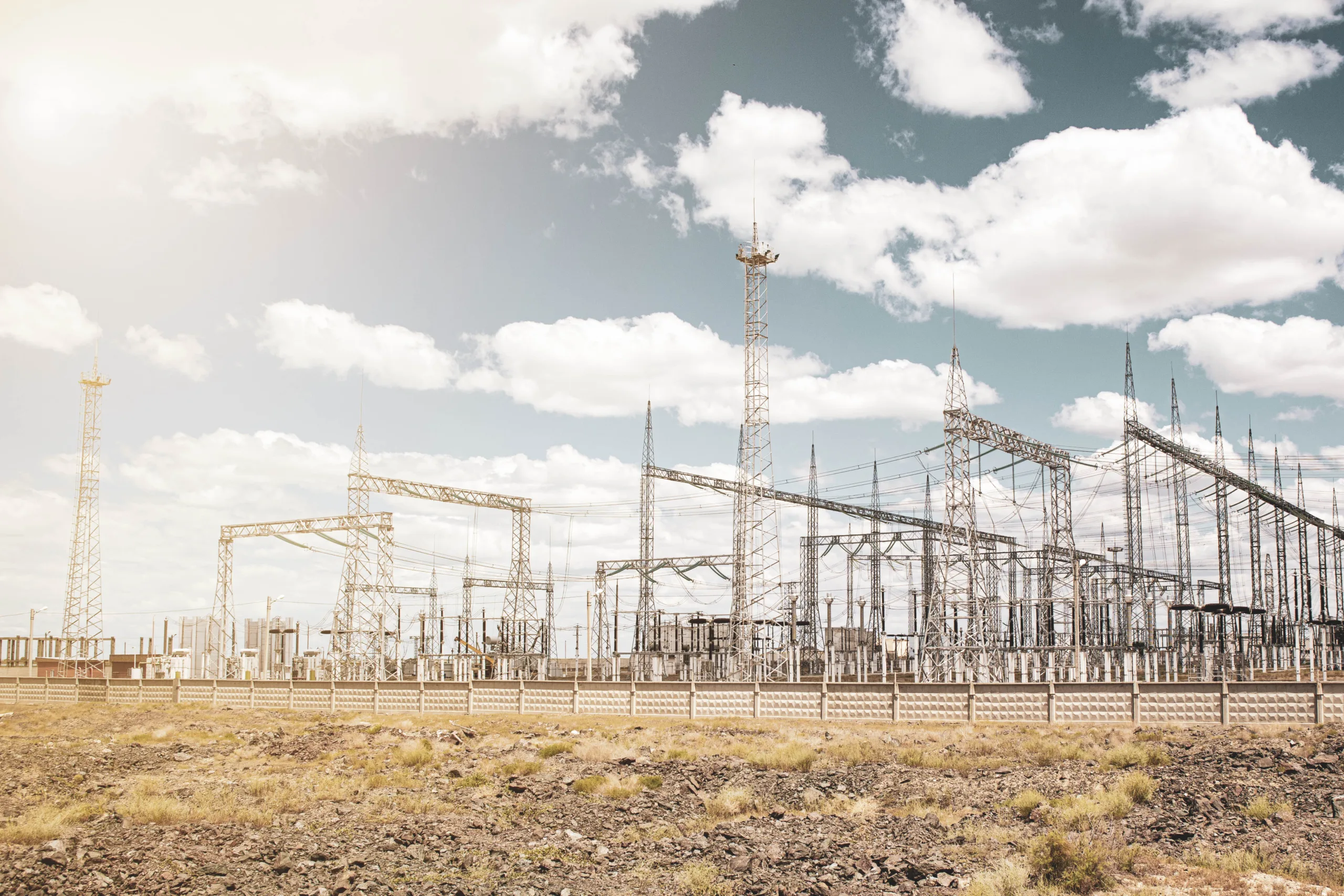 large electrical substation in the desert against the blue sky