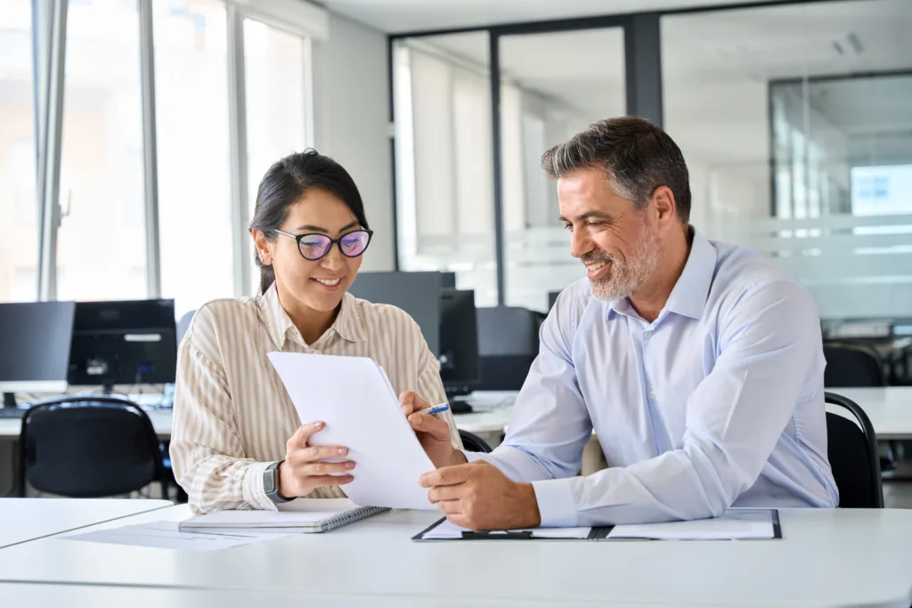 Professional recruiter reviewing resume with female