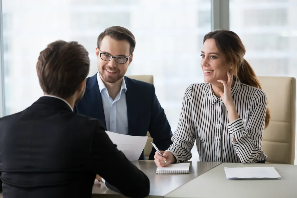 Team working together around table on project and enjoying company