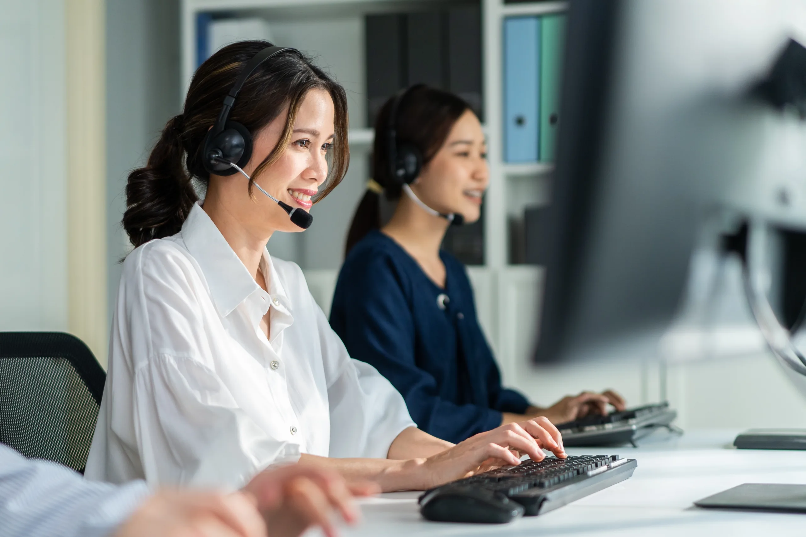 Two females answering in a call center