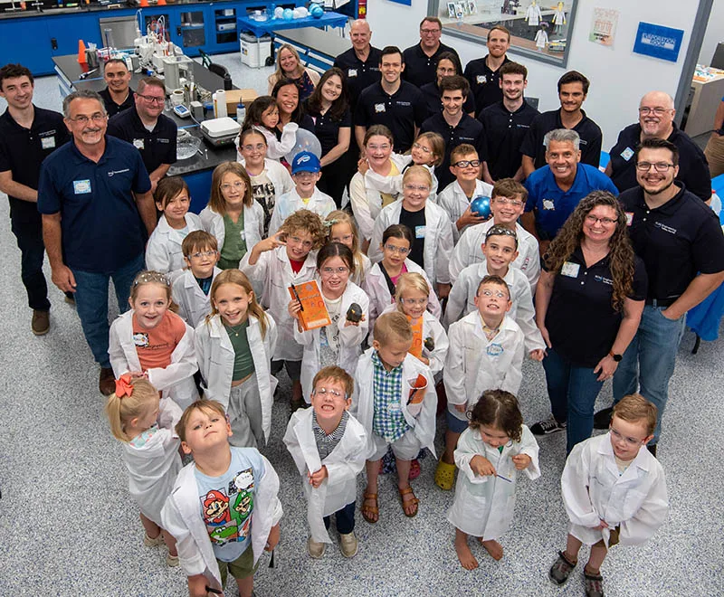 group photo of kids and engineers at annual kids day stem event