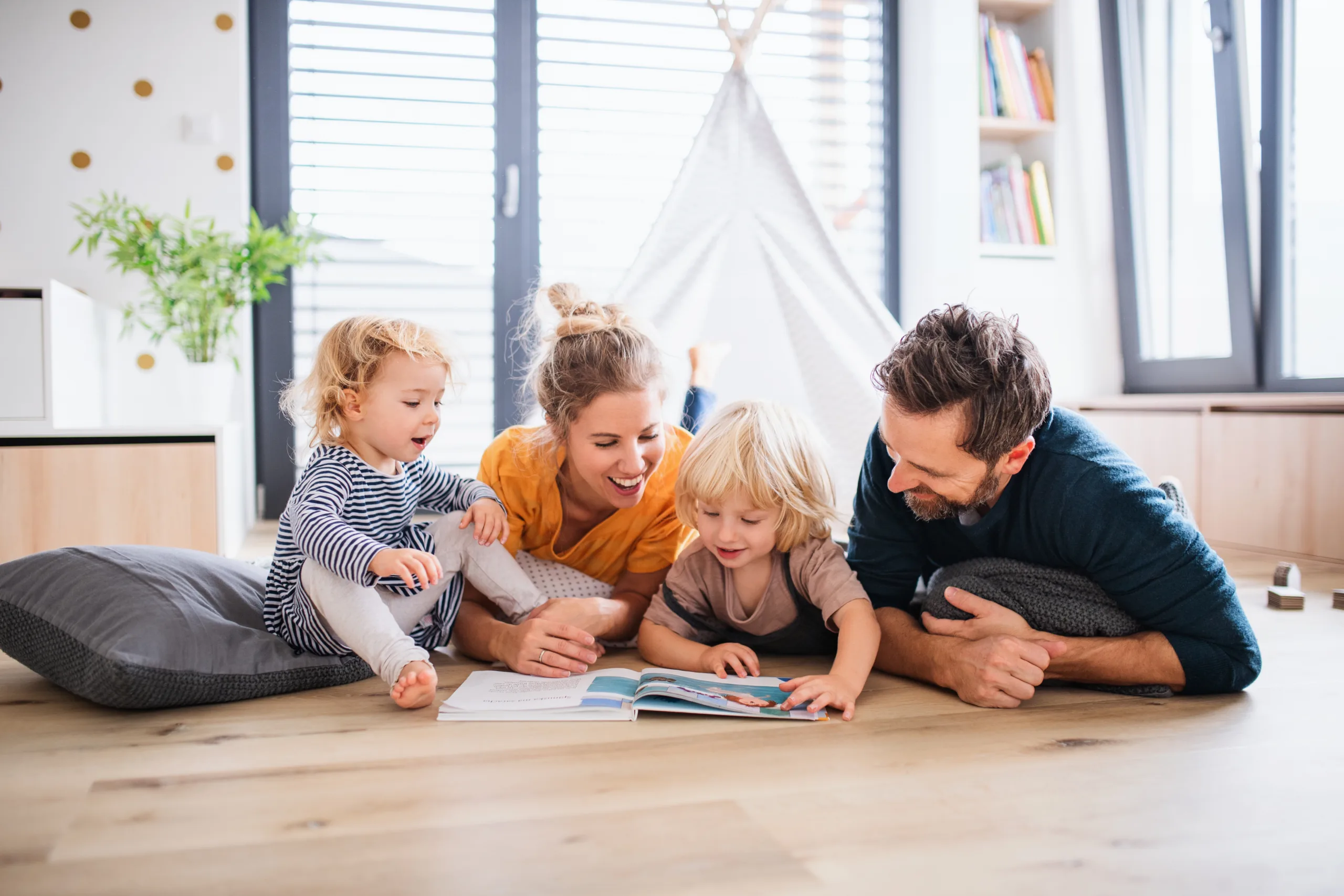Family reading a book.