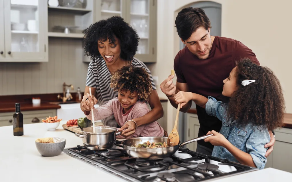 Family cooking together in their kitchen