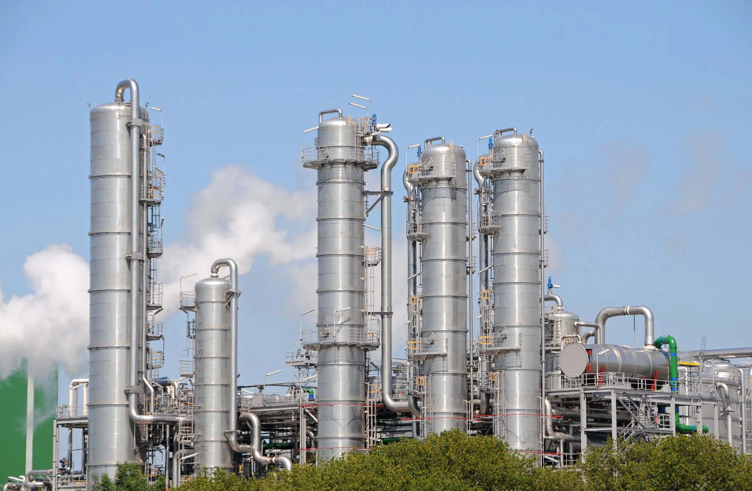 ethanol production towers with blue sky in the background